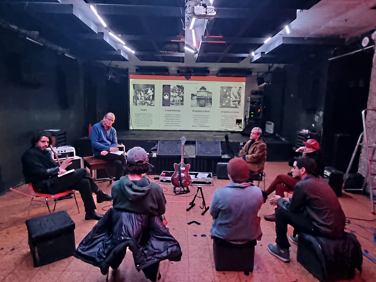 Guitarists gathered with instruments at the Berlin project launch