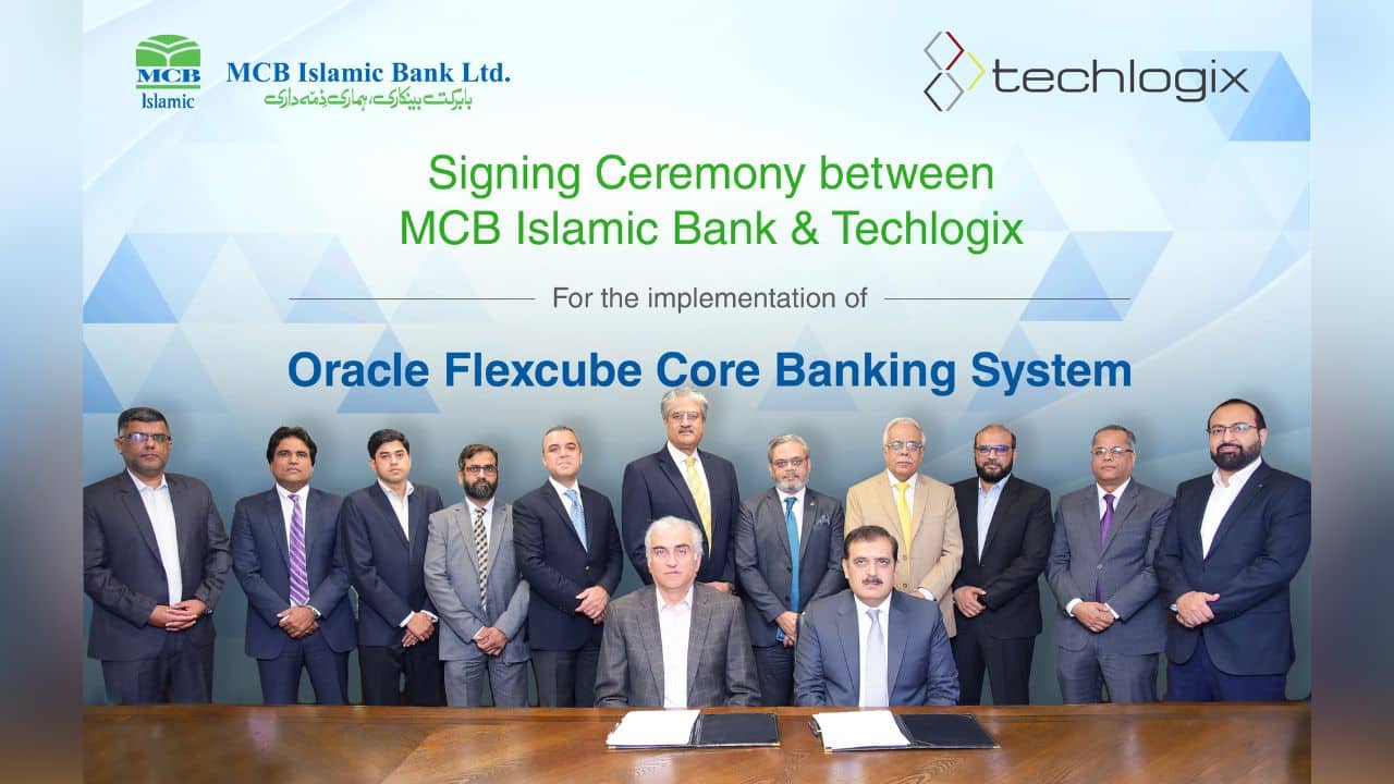 Salman Akhtar, seated left, with Techlogix and MCB Islamic Bank representatives at a signing ceremony