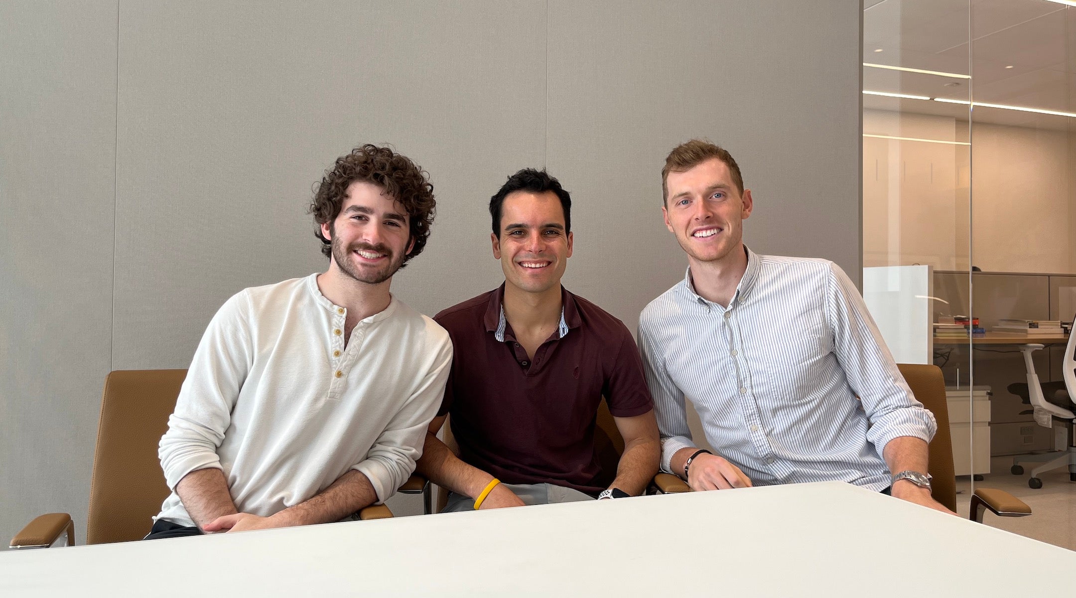 Drew Schneider, Salo Serfati and Aaron Kahane seated together in a Midtown office