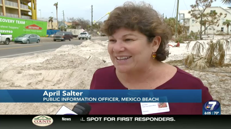 April Salter speaking with a television reporter in storm-damaged Mexico Beach