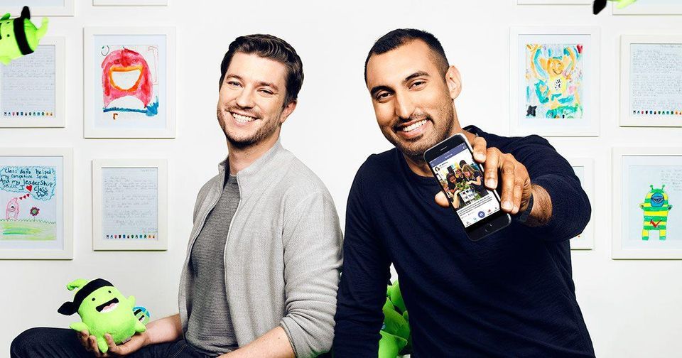 Liam Don, left, and Sam Chaudhary, right, with ClassDojo toys and a phone displaying the app