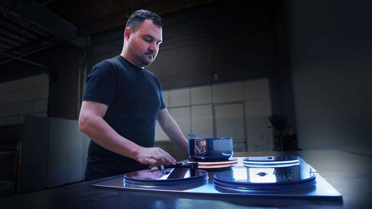 Sam D’Amico beside an Impulse cooktop during the S³ interview