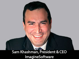 Archival press photograph of Sam Khashman smiling in a dark suit