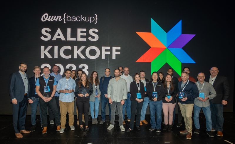 OwnBackup team members with awards at the company's 2023 sales kickoff