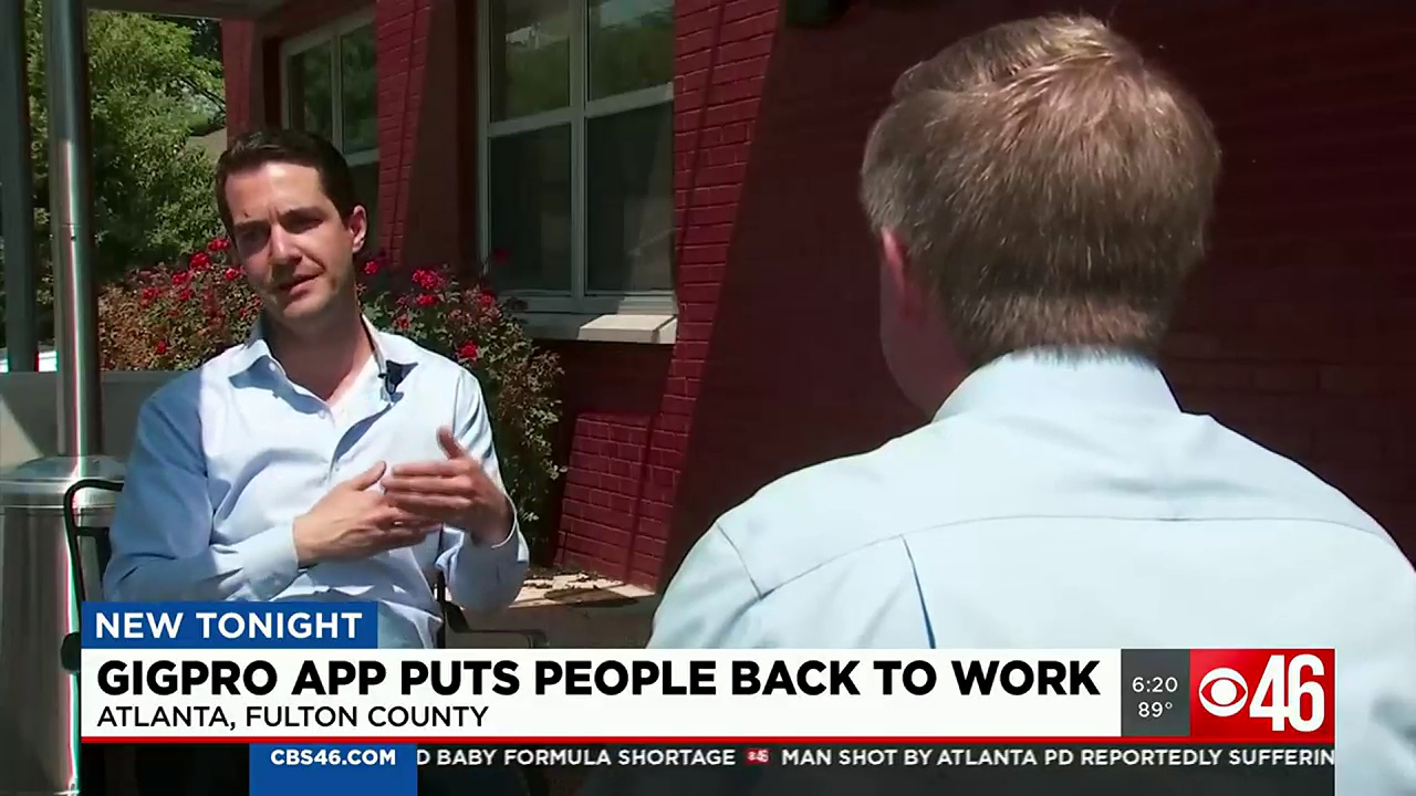 Sam Mylrea, left, speaking with a CBS46 reporter outside Lake and Oak BBQ in Atlanta