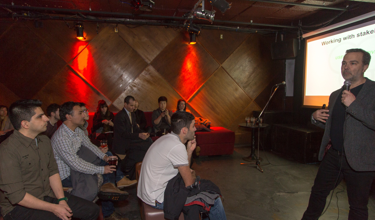 Participants listen to a speaker at a Montreal ProductTank event on transportation