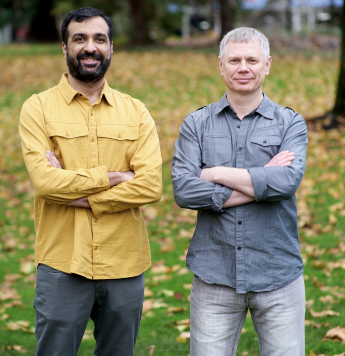 Samar Abbas, left in a yellow shirt, and Maxim Fateev, right in a gray shirt, standing outdoors
