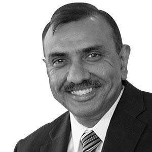 Black-and-white press portrait of Samir Gulati during his ServicePower tenure