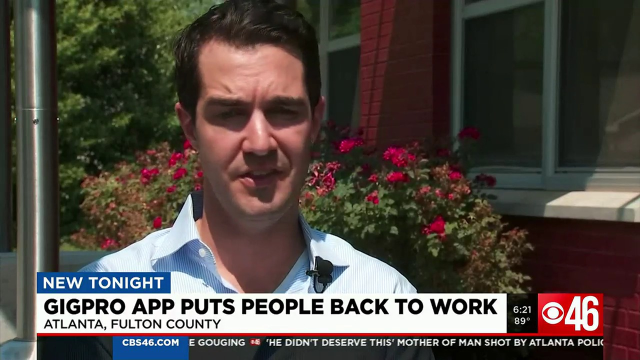 Sam Mylrea speaking outdoors during a 2022 television interview about the Gigpro hospitality staffing app