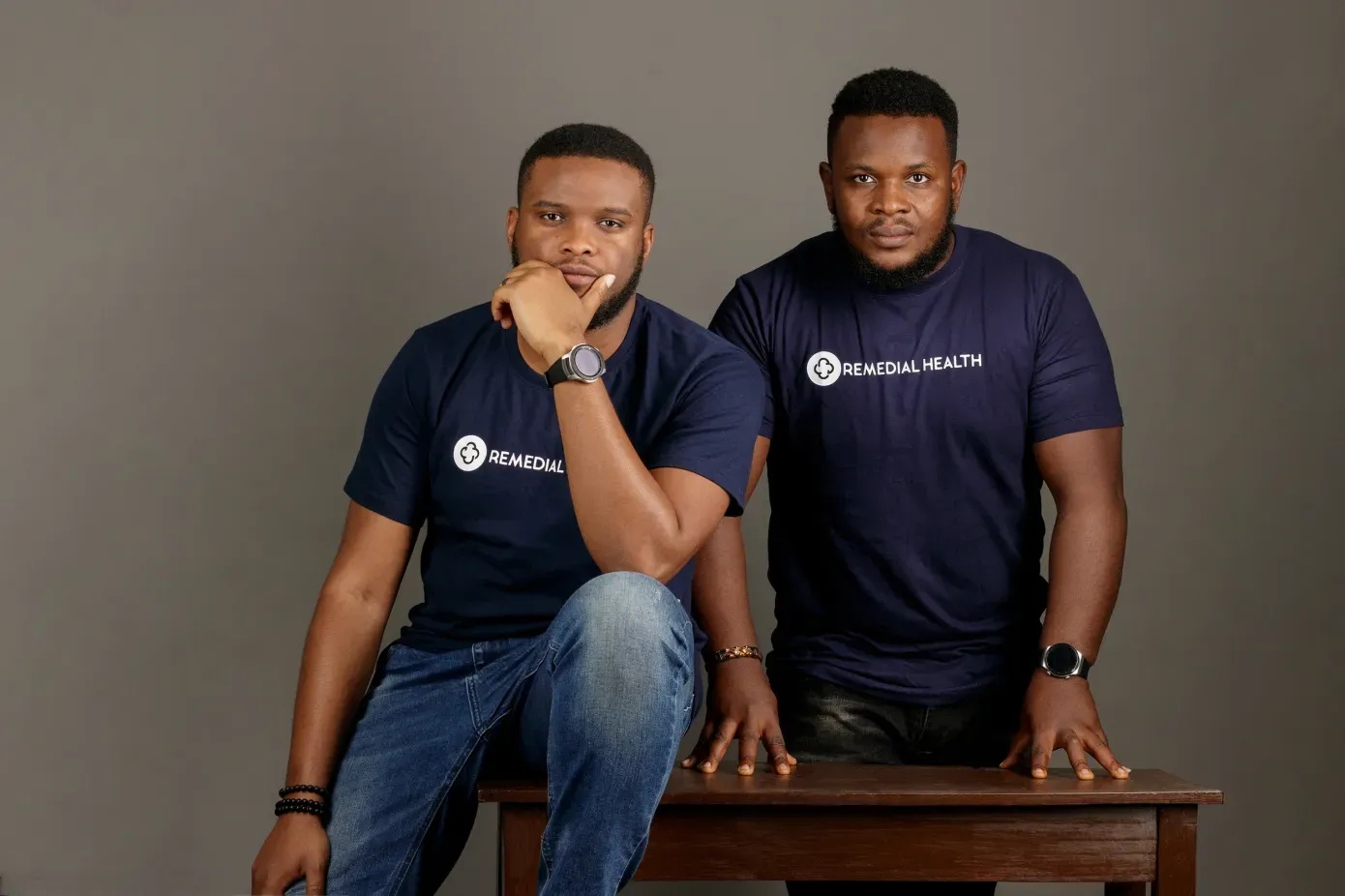 Samuel Okwuada seated at left beside Remedial Health co-founder Victor Benjamin at right