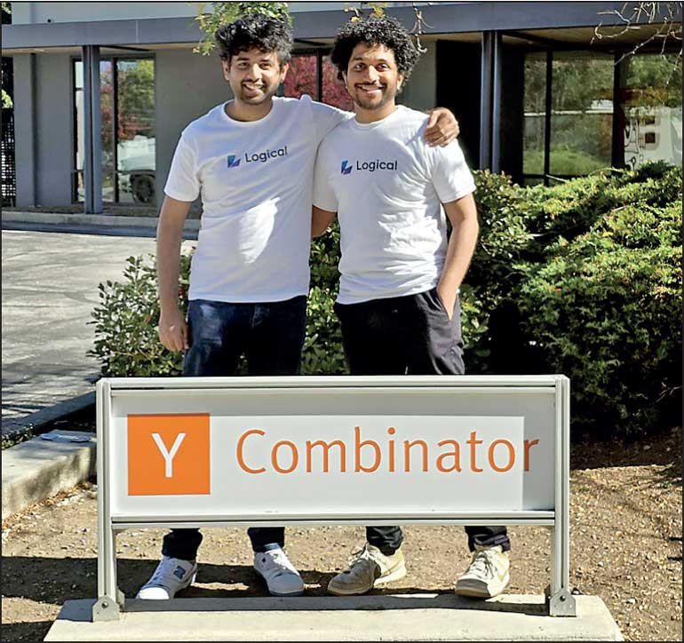 Anushka Idamekorala, left, and Samurdhi Karunaratne standing together behind a Y Combinator sign