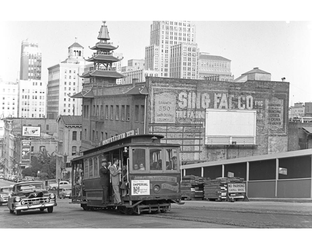 A California Street cable car climbs a hill above Chinatown in July 1951