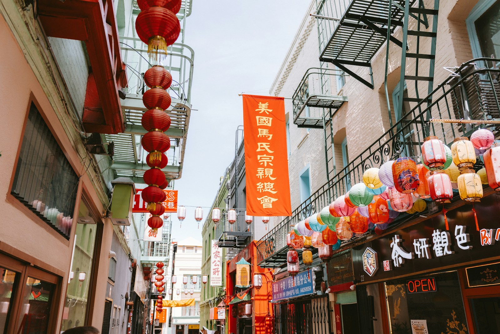 Colorful decorations strung above a street in San Francisco’s Chinatown