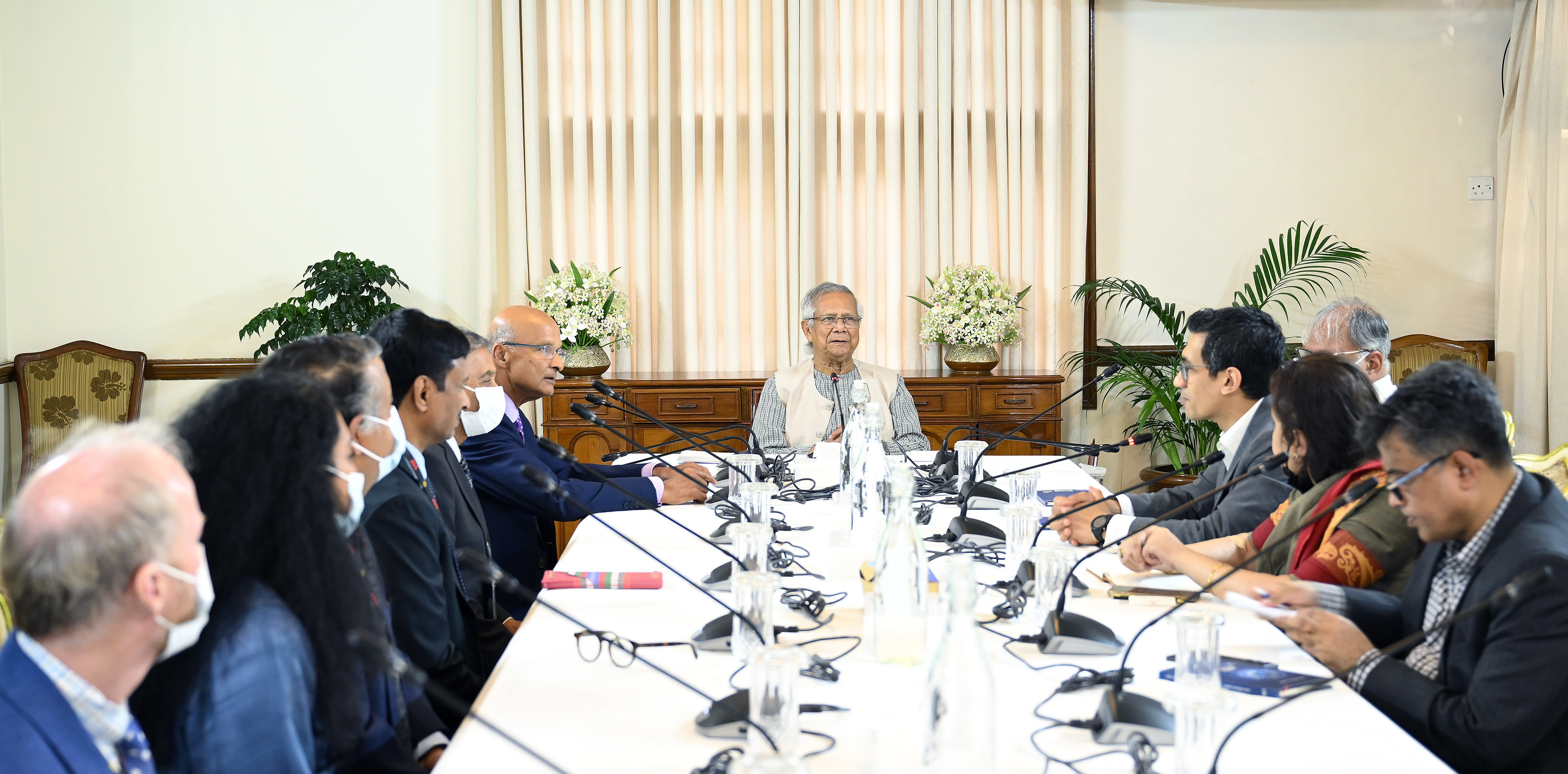 An Exo Imaging delegation meets Muhammad Yunus across a conference table in Dhaka in September 2025.