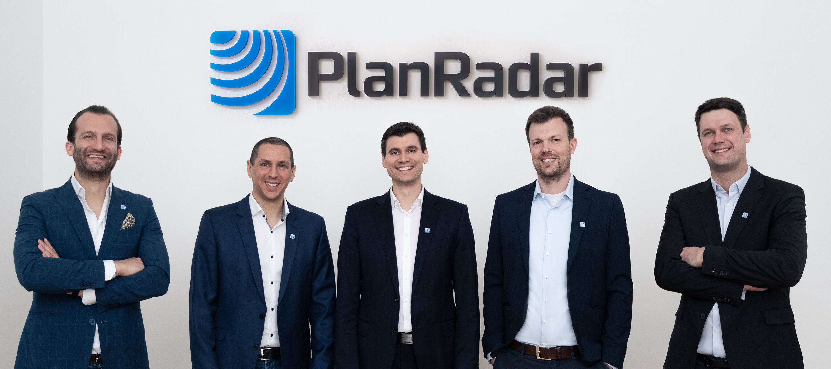 PlanRadar’s five founders standing together, with Sander van de Rijdt on the far left