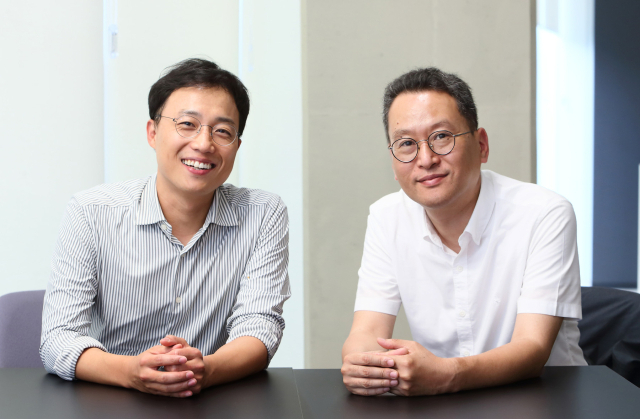 Sanghoon Park, left, and Prazer Therapeutics founder Kyungsoo In seated together during an interview