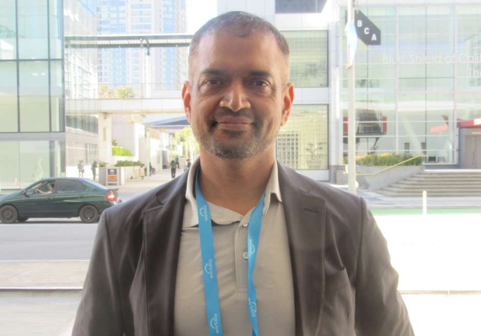 Sanish Mondkar wearing a conference badge at Workday Rising