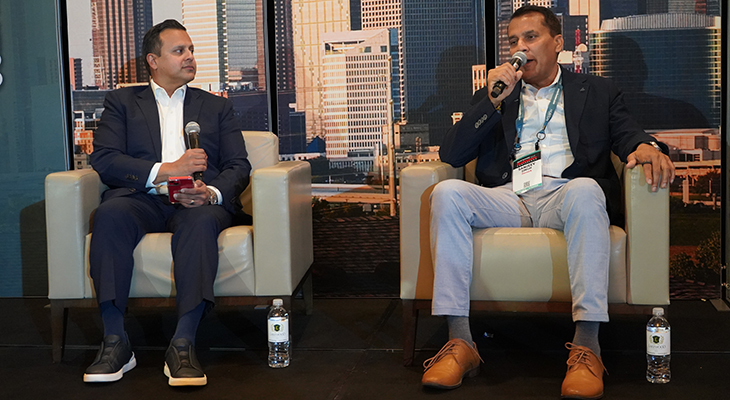 Sanjeev Singh speaking during a seated conversation at the Dallas Smart Business Dealmakers Conference