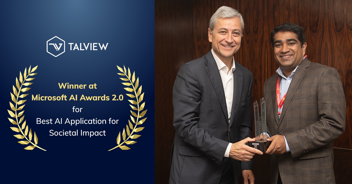 Sanjoe Tom Jose, at right, holding an award in Talview’s Microsoft AI Awards 2.0 event photograph