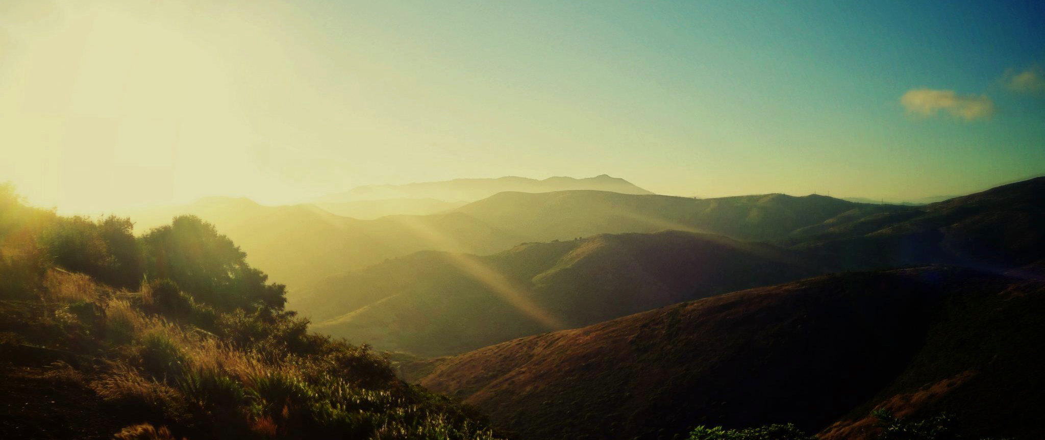 Layered hills in warm evening light, photographed for Sansome’s website.