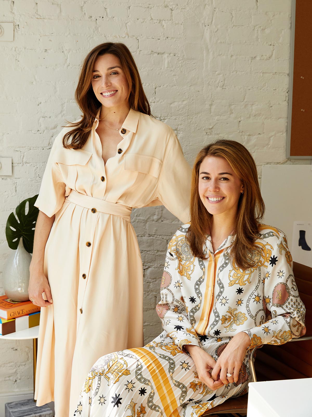 Sarah Pierson standing beside seated co-founder Alexa Buckley in the Margaux studio