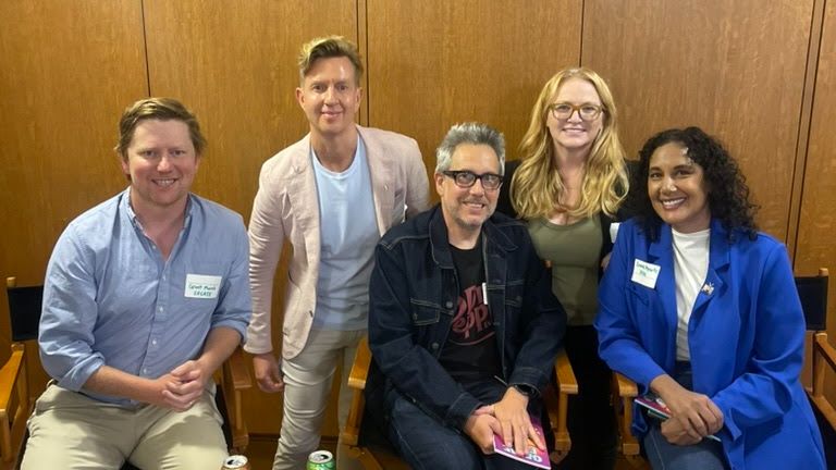 Five participants at The Changing Media Landscape panel, with Sarah Segal standing second from right.