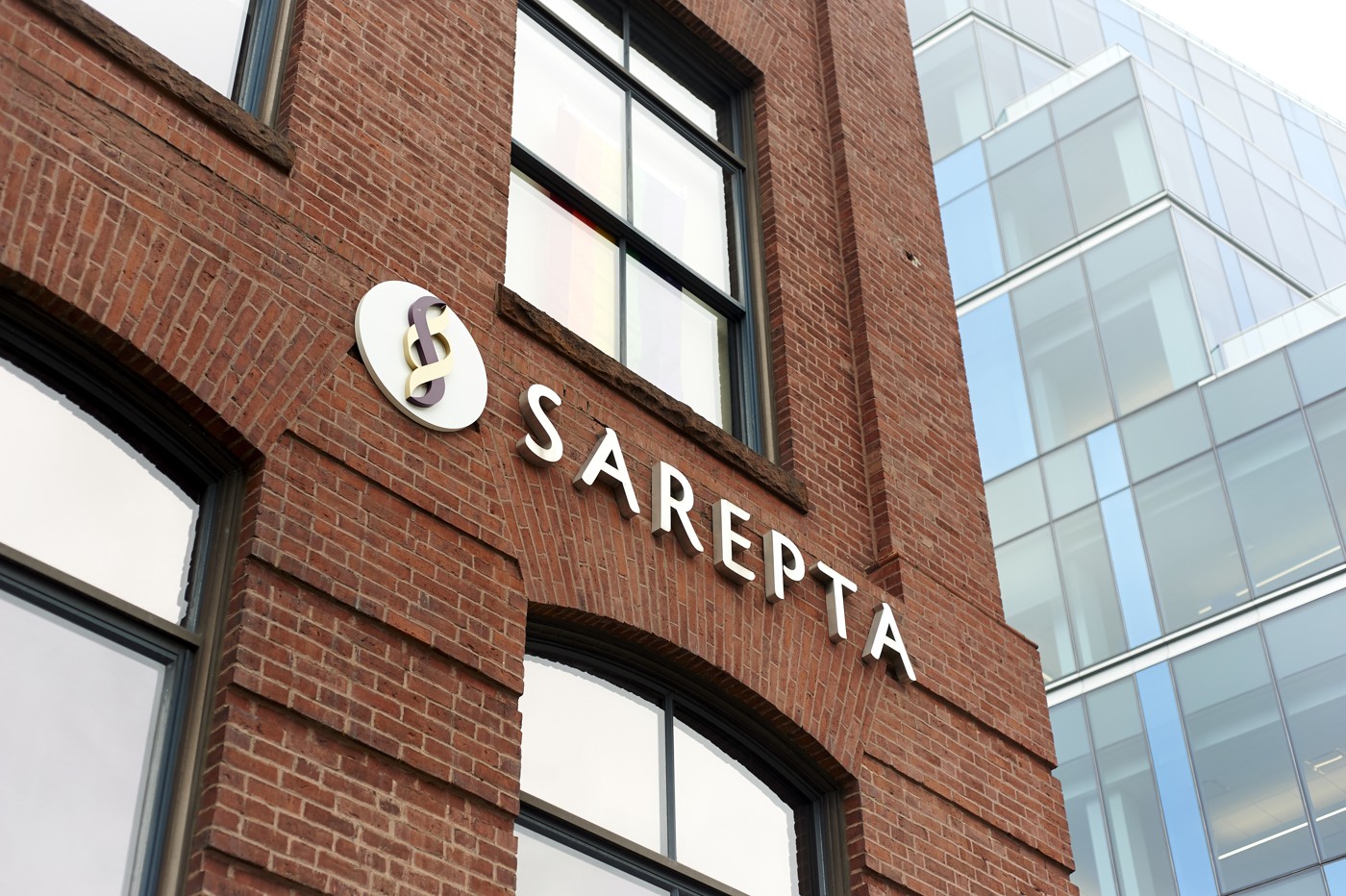 Sarepta sign on the brick exterior of a company building