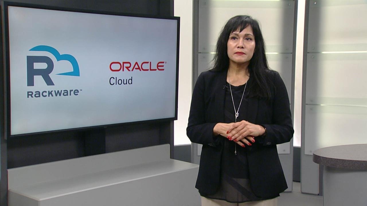 Sash Sunkara speaking beside a screen displaying RackWare and Oracle Cloud logos