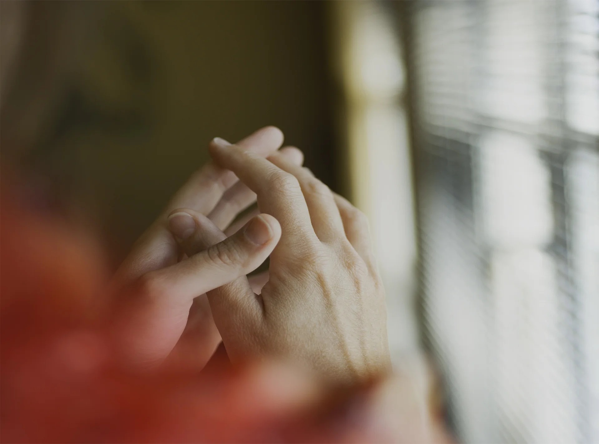 Close-up of hands in a quiet moment, from Savage Brands' official brand photography