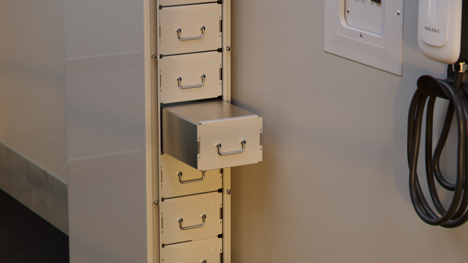 Savant product rendering showing an open battery storage drawer beside an electrical panel and EV charger