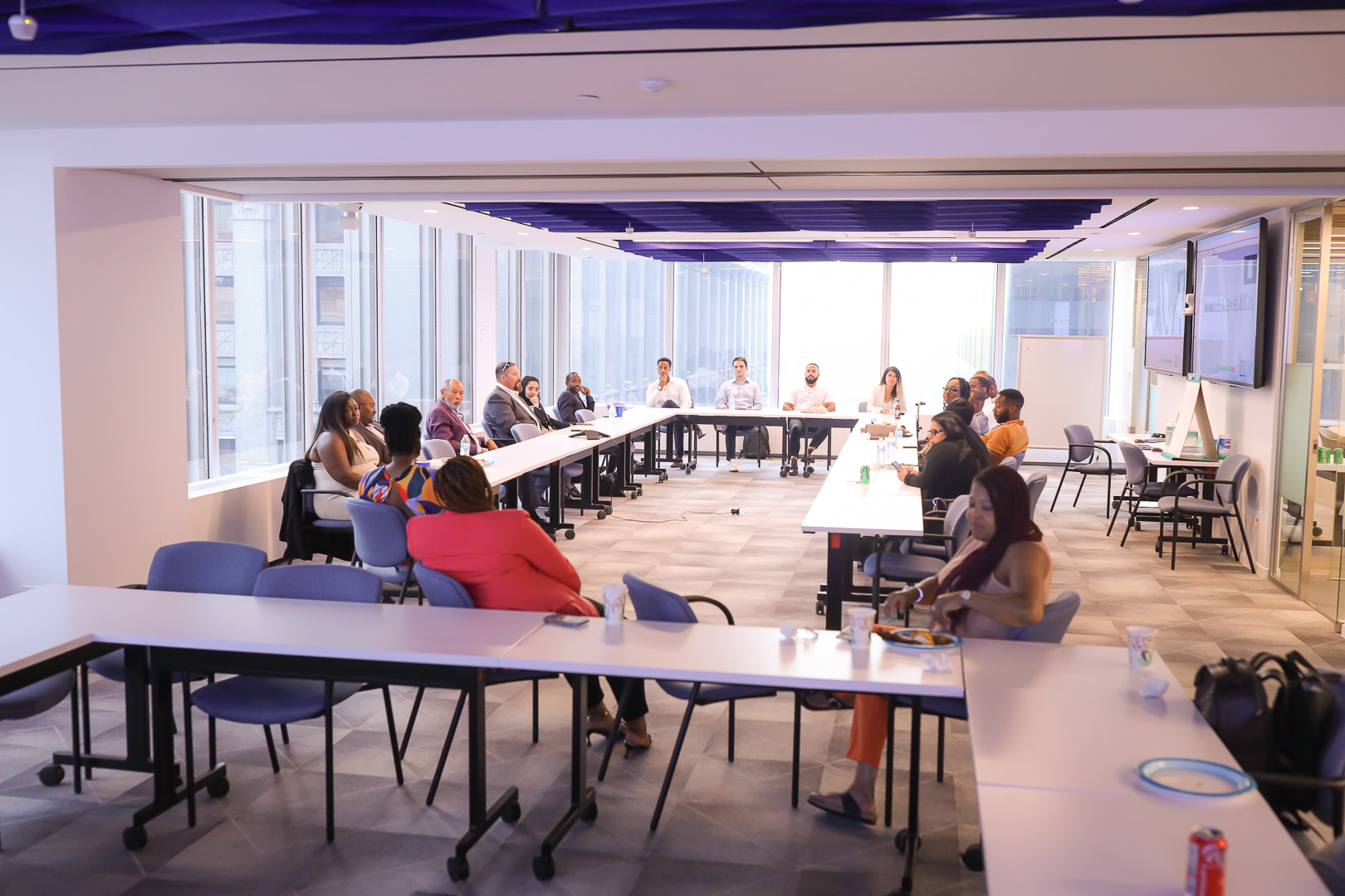 A meeting room during Schelton Assoumou’s 2022 LISC NYC developer-program presentation
