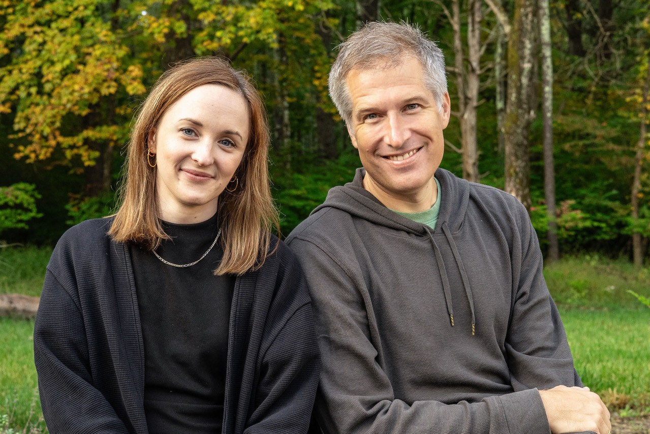 Scope3 co-founders Anne Coghlan and Brian O'Kelley seated outdoors