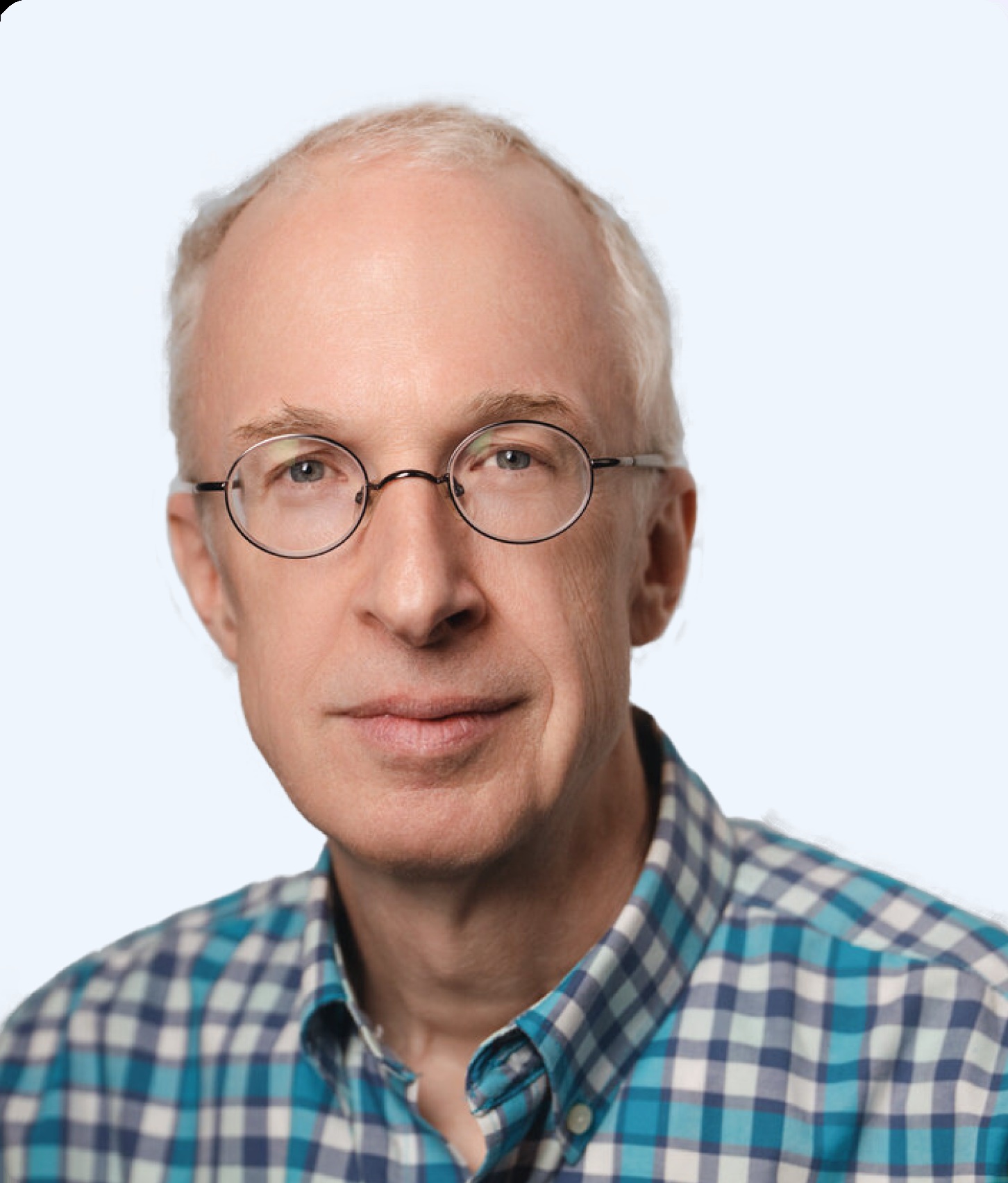 Scopic founder Tim Burr wearing glasses and a checked shirt