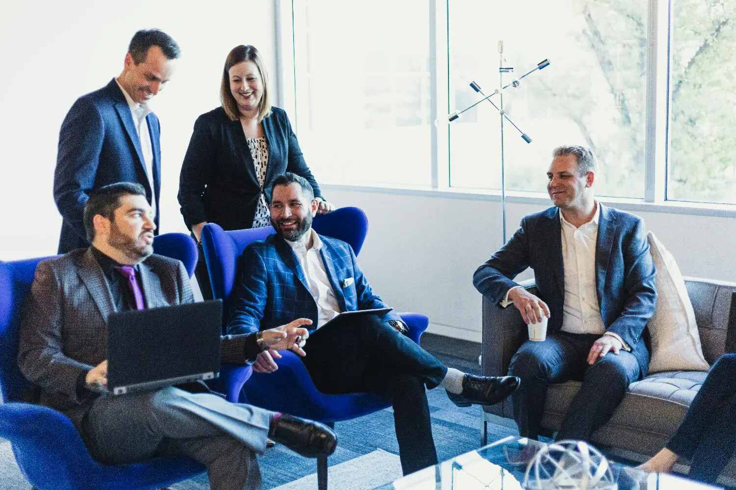 Scorpion colleagues meeting in a bright office