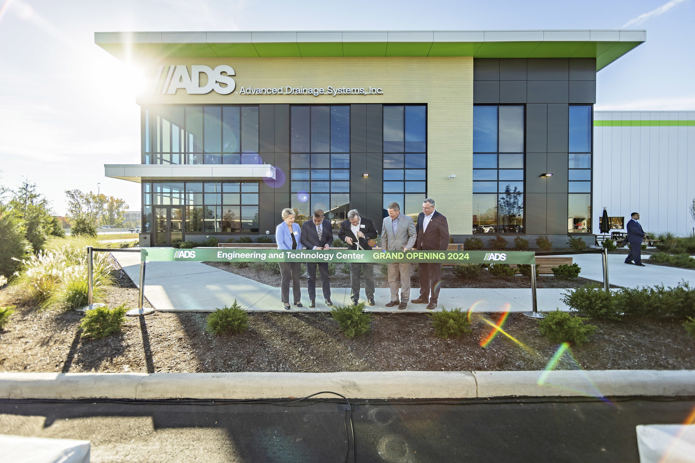 Ribbon cutting outside the ADS Engineering and Technology Center in Hilliard in October 2024
