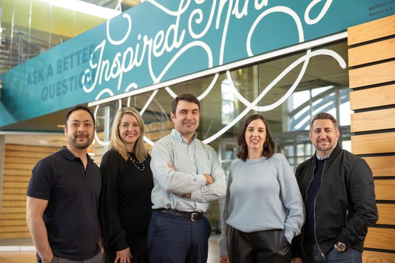 Marcus Thomas leadership team in the agency office, with Scott Chapin in the center