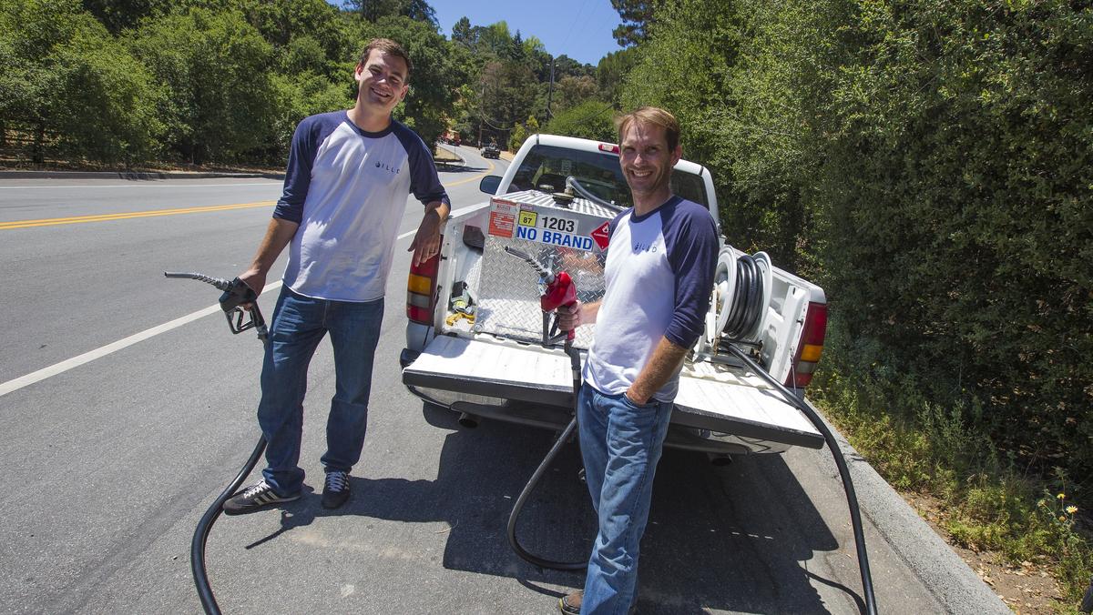 Scott Hempy, left, and Chris Aubuchon beside an early Filld fuel delivery truck