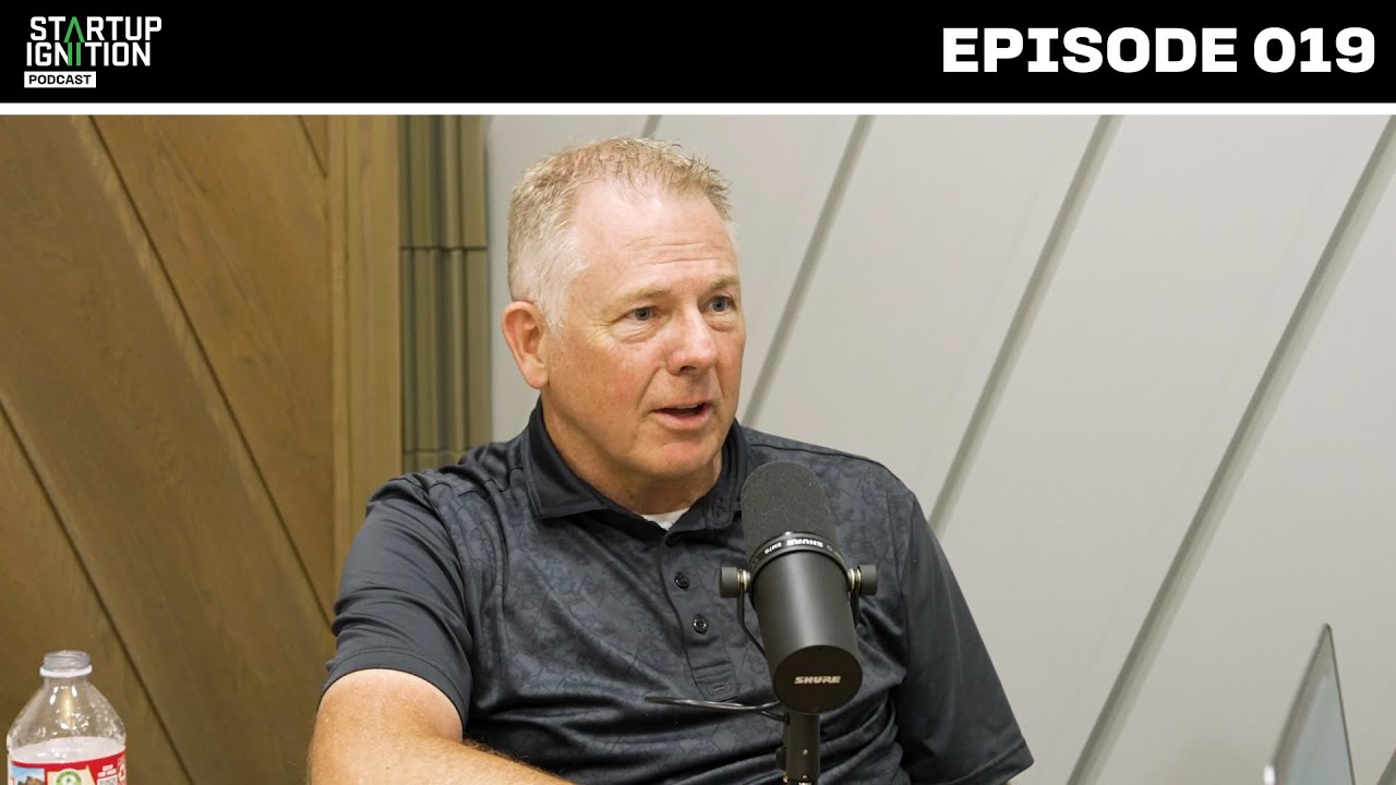 Scott Johnson speaking into a microphone on the Startup Ignition podcast