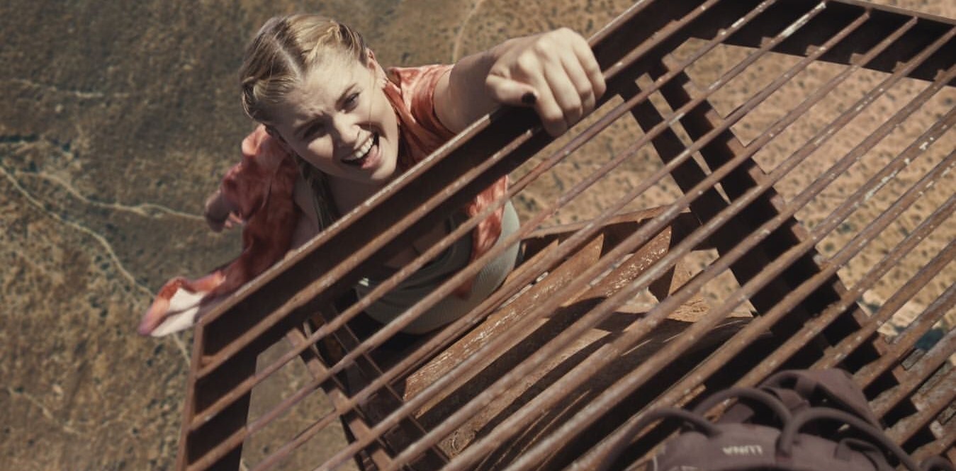 Virginia Gardner climbing the radio tower in a scene from Fall