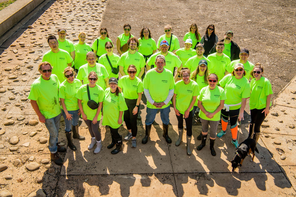 Pipitone volunteers wearing bright green shirts at the What the Muck cleanup