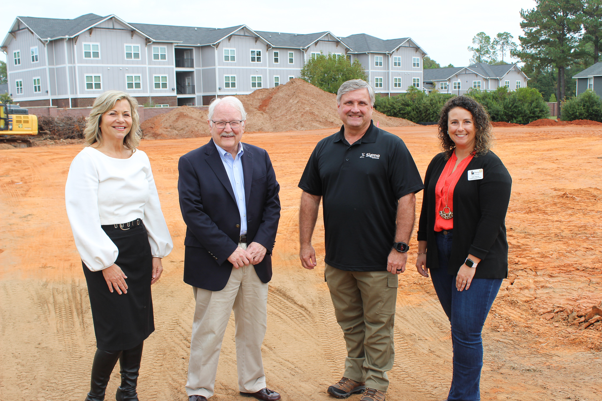 Scott Ritchie, second from right, with Perry Mayor Randall Walker and other attendees at the Sigma Defense production facility site