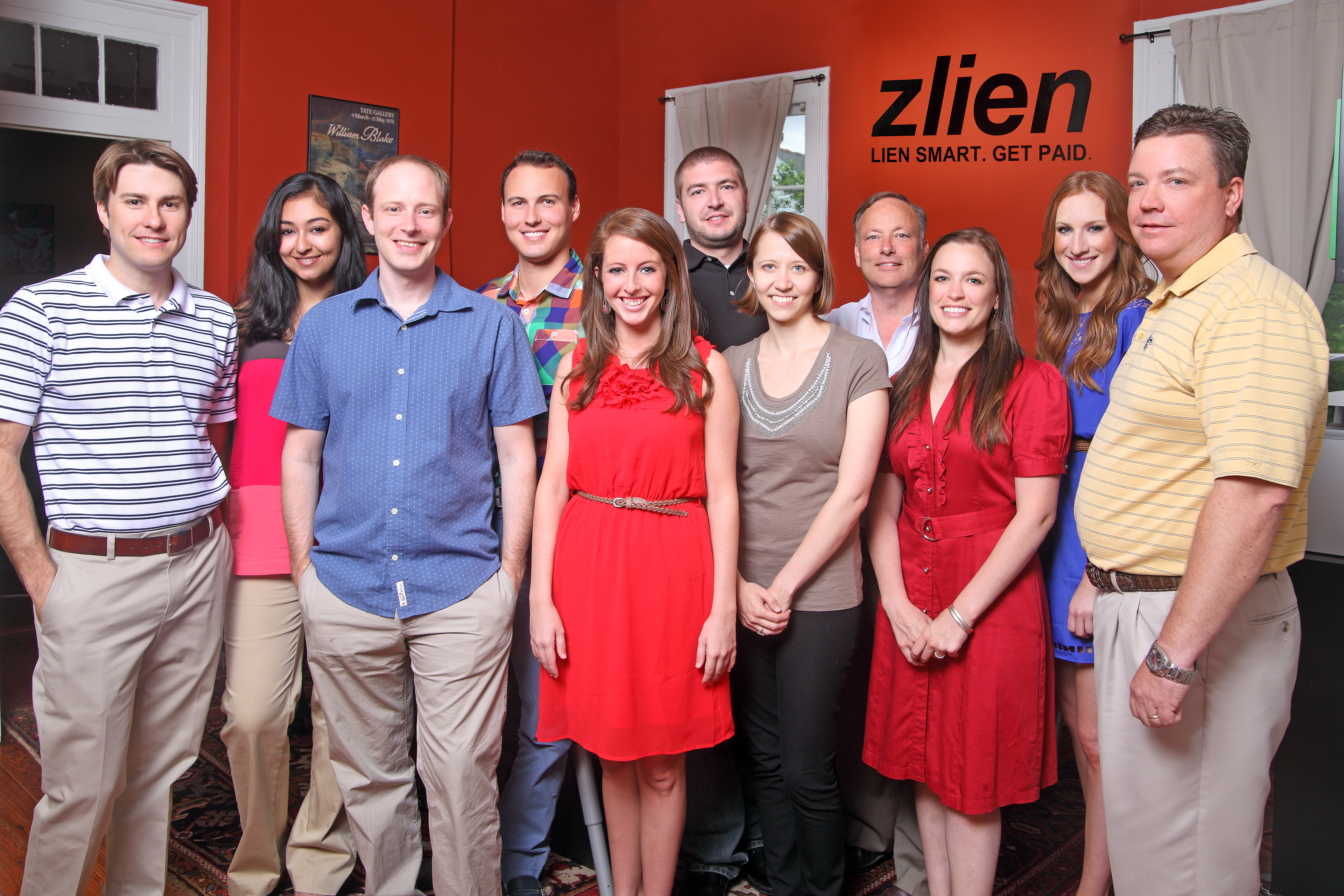Scott Wolfe Jr., third from left, with the zlien team in an orange-walled office