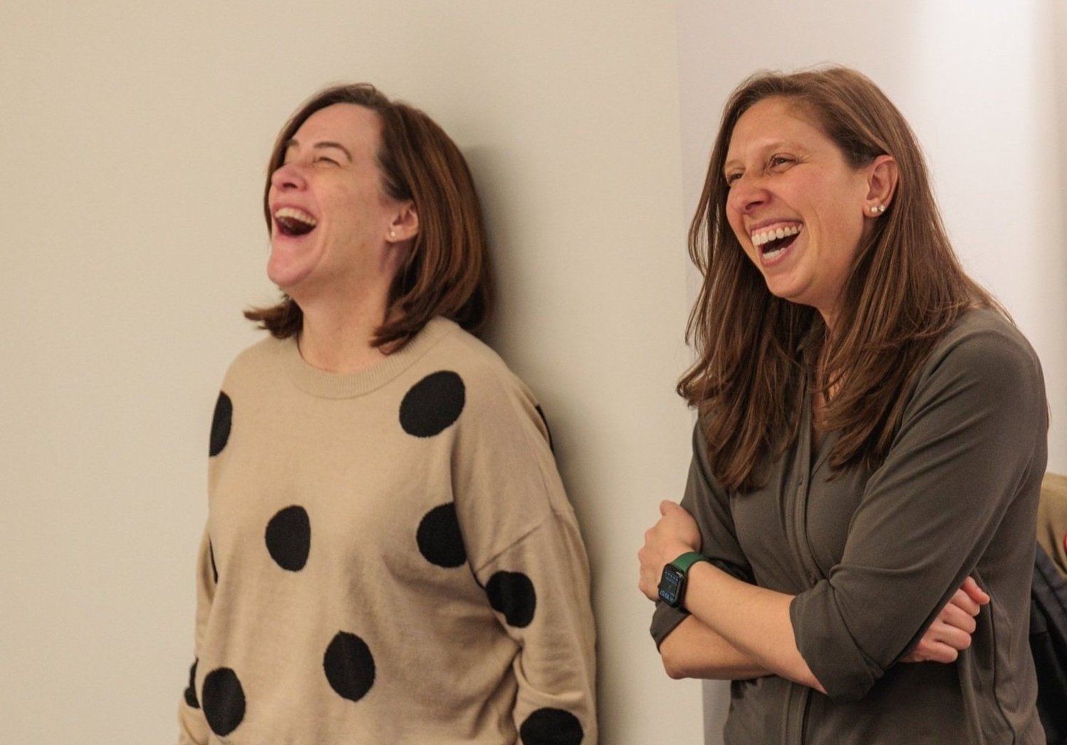 Allison Byers laughing with a colleague at a Scroobious gathering