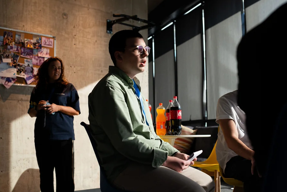 A Tbilisi .NET hackathon participant talking during the event