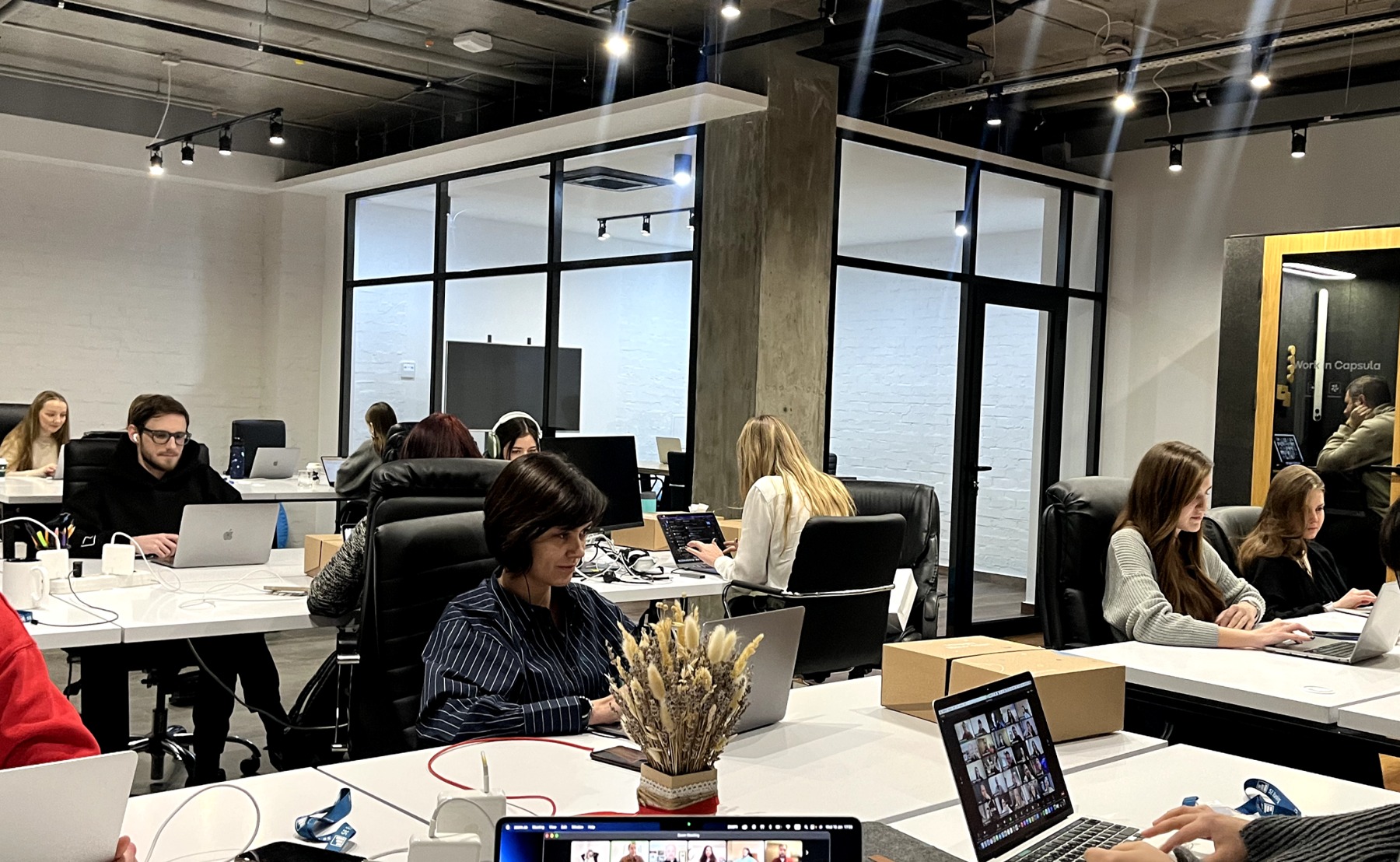 SE Ranking staff working together around office tables