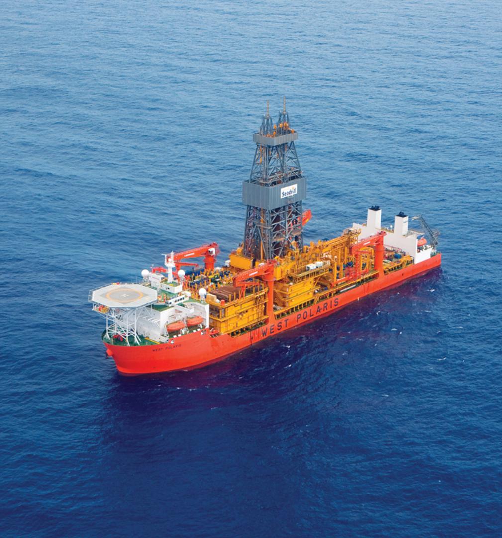 Aerial view of Seadrill’s West Polaris drillship, showing its derrick, deck equipment and helipad