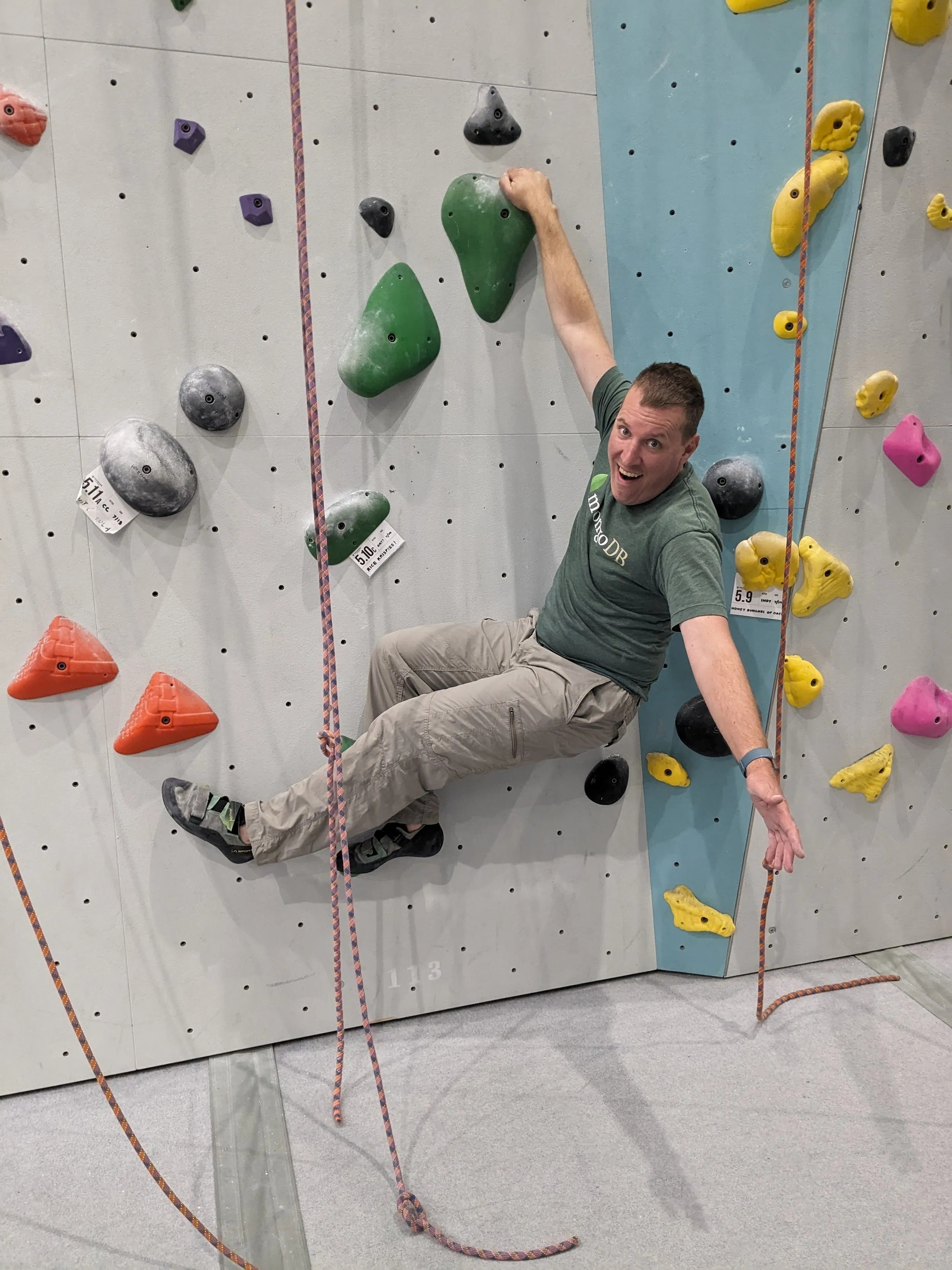 Sean Byrnes climbing an indoor climbing wall