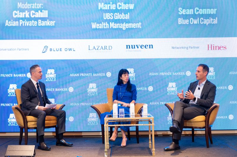 Sean Connor, seated at right, speaks with Marie Chew and moderator Clark Cahill at the 2023 Asian Private Banker Summit.