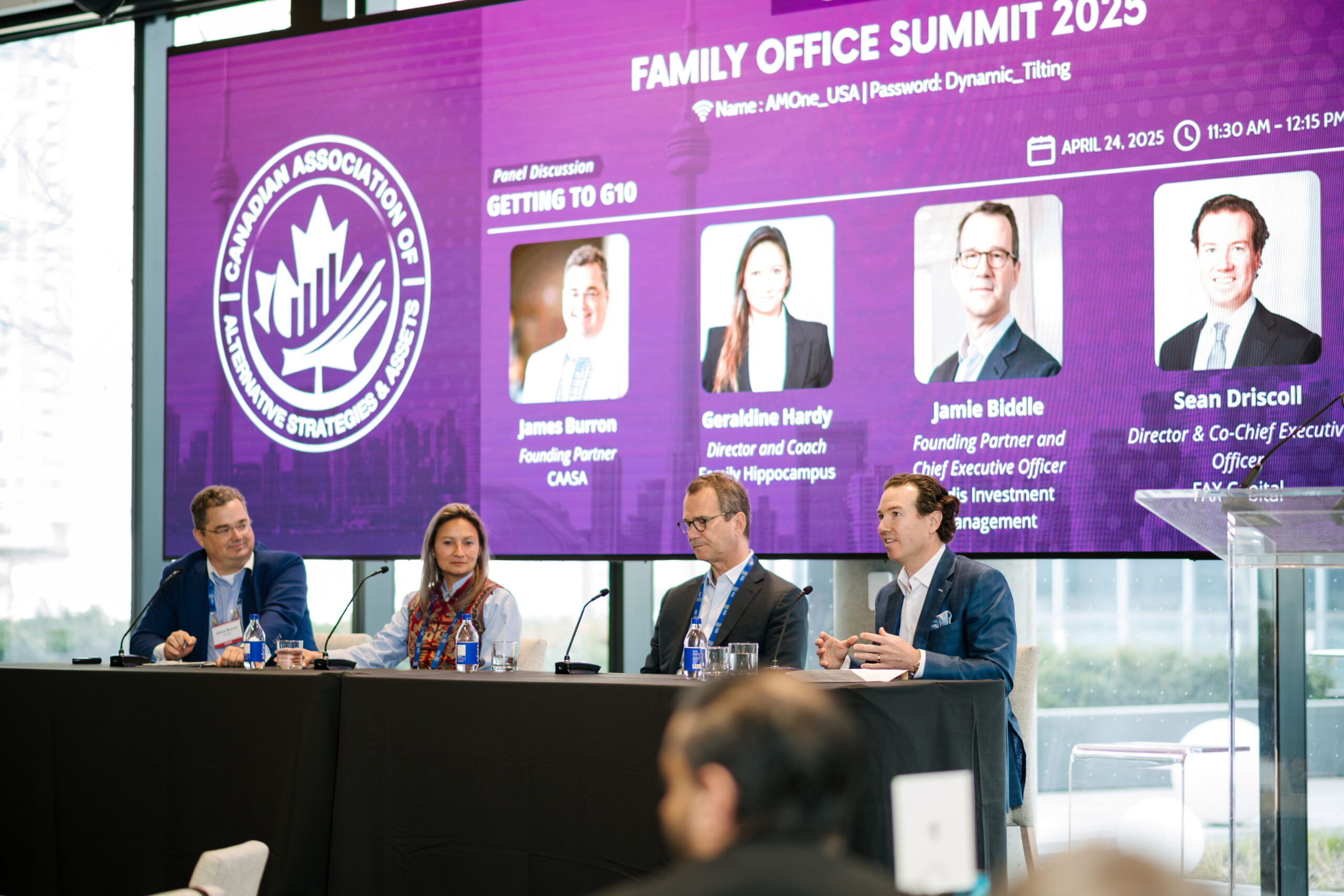 Sean Driscoll seated at the right of a four-person Getting to G10 panel at the 2025 Family Office Summit