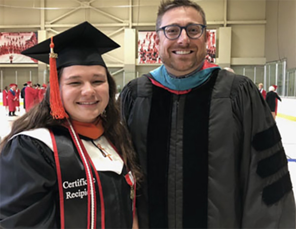 Rachel Duke and Sean Lane smiling in academic robes at Miami University’s 2022 recognition ceremony